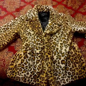 A beautiful cheetah coat, used twice, clean and modern